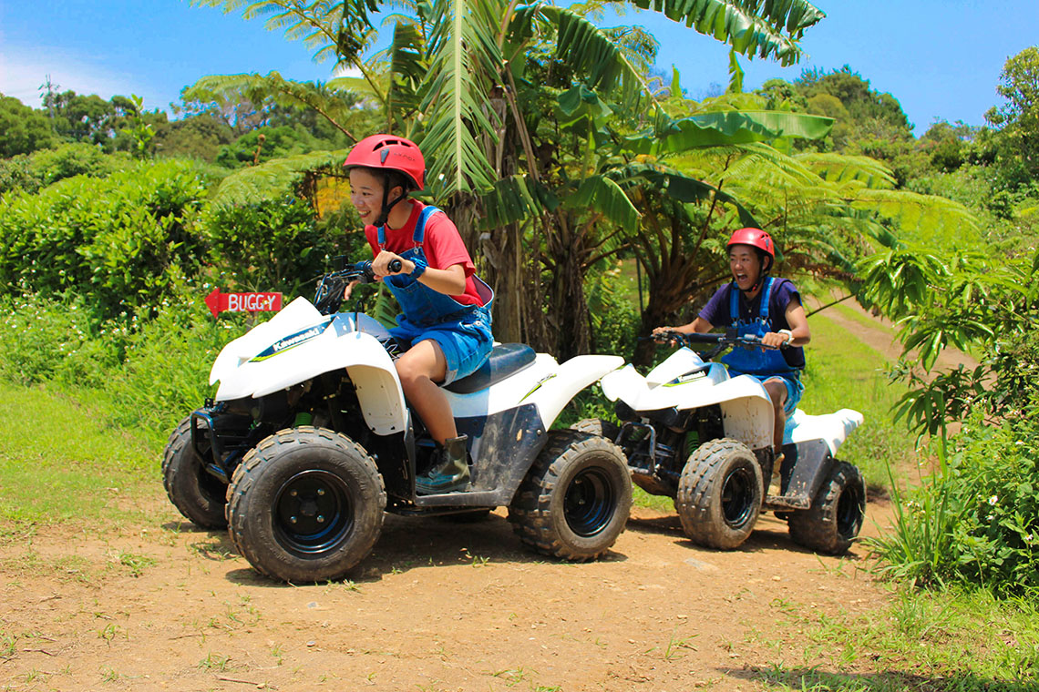 two people on ATVs